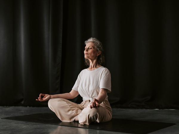 Close-up of hands in a meditative mudra position.